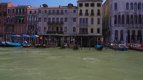 Parked Gondolas and Vaporettos, View of Tour Boats Along Grand Canal in Venice