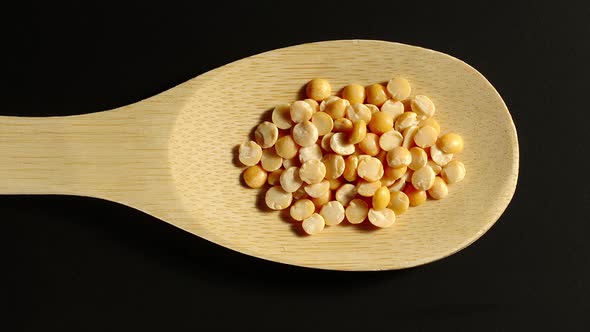 Yellow Peas Appear In Wooden Spoon