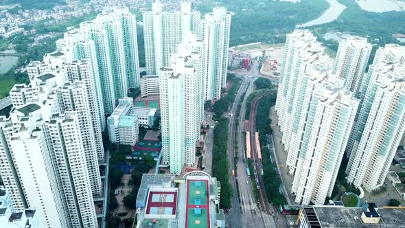 Fly drone over residential district in Hong Kong city