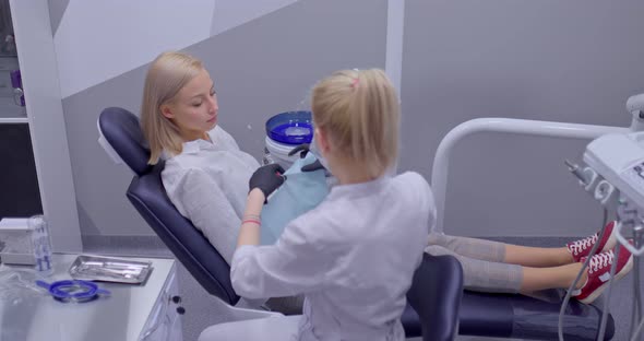 Doctor Puts a Napkin on the Patient