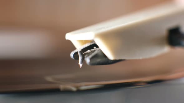 Putting Needle on Vinyl Plate on Vintage Record Player Macro