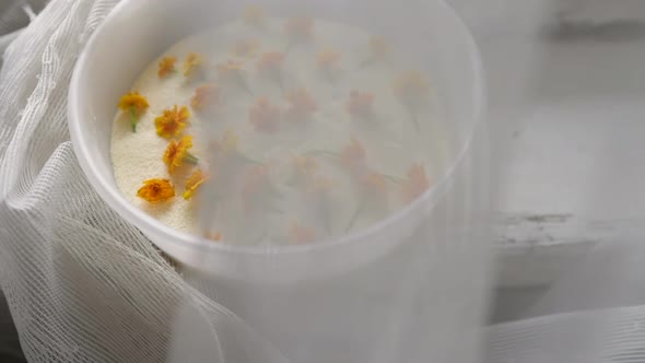 Dry Yellow Flowers in Semolina Near the Window. Dried Flowers in a Cup for Creativity in a Rustic