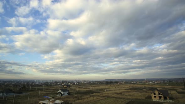 Time lapse footage with fast moving storm clouds on blue sky.