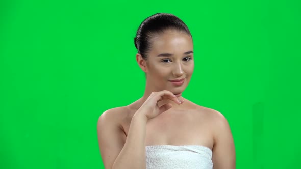 Girl in Towel Touches Her Hand To Her Delicate Skin Face, Green Screen, Slow Motion