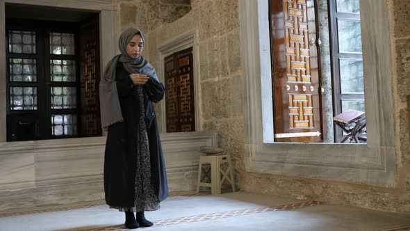 Muslim Woman Prayer with Stone Background