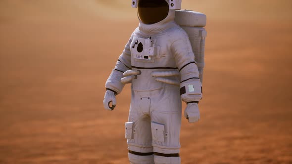 Astronaut on Mars Surface. Red Planet Covered in Gas and Rock