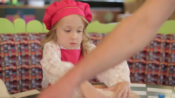 Children make pizza. Master class for children on cooking Italian pizza.