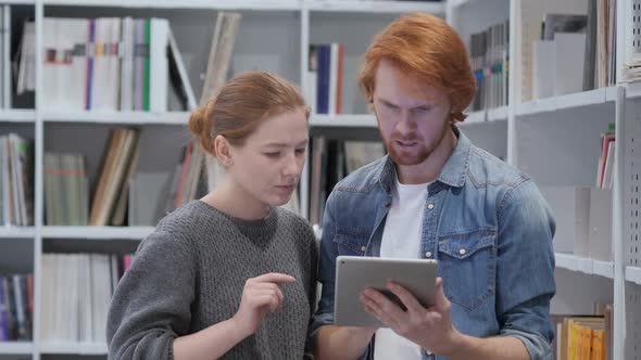 Young Teammates Reacting to Loss Email on Tablet PC Upset