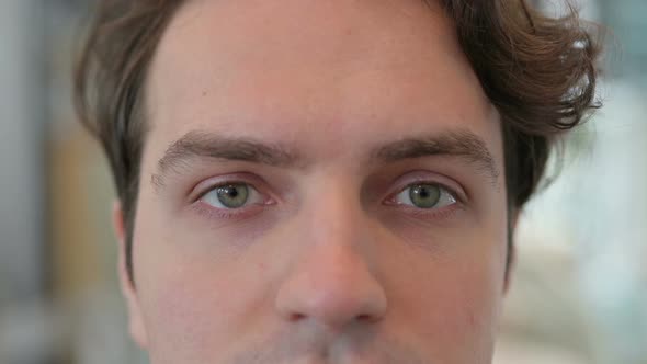 Close Up of Blinking Eyes of Young Man