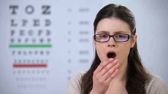 Sleepy Female Patient Yawning, Waiting for Appointment, Poor Service Quality