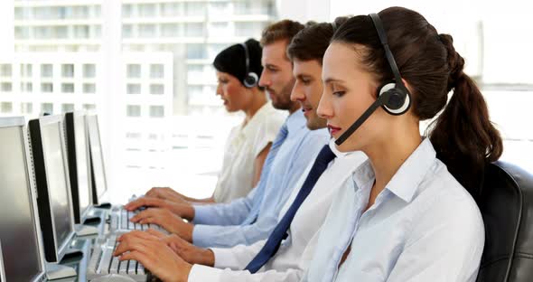 Happy call centre agent looking to camera