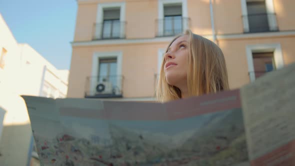 Young Woman with City Map in Old European Town