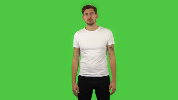 Confident Upset Guy Is Shrugging and Sighing. Green Screen