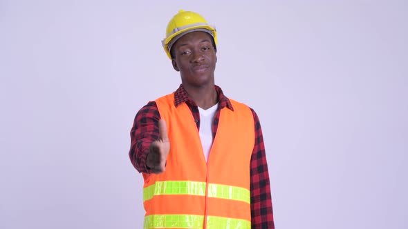 Young Happy African Man Construction Worker Giving Handshake