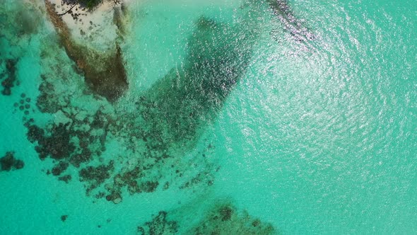 Wide above abstract view of a white sand paradise beach and blue sea background 