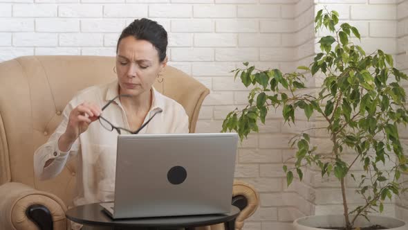 Tired Woman Close Eyes with Palms