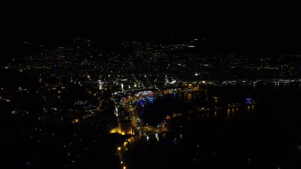Night Drone View of Harbor and City