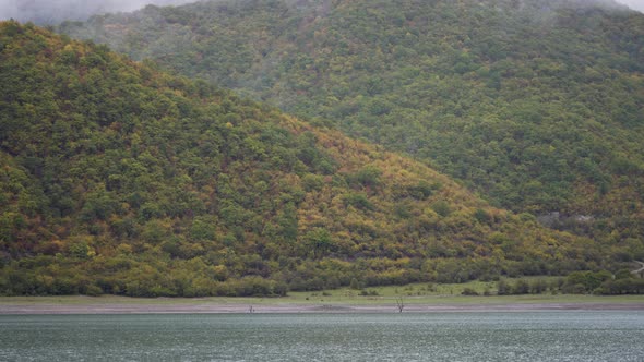 Autumn landscape of the lake and hills alt
