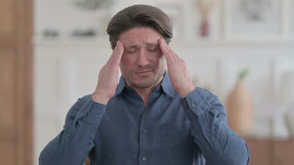 Portrait of Young Man having Headache