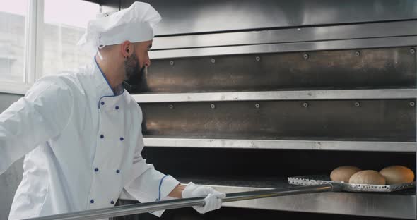 Charismatic Baker with a Beard Using a Special