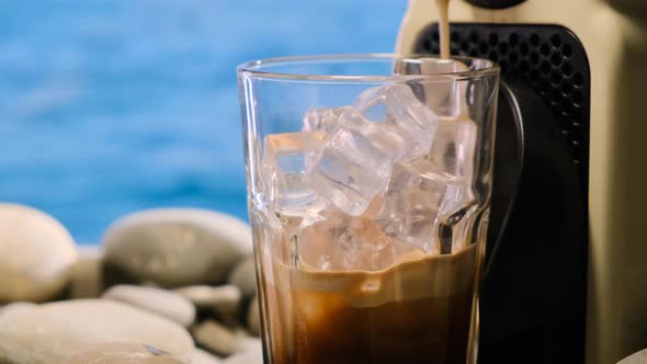 Close Up Iced Coffee Early Morning at Sea Making Latte on Vacation By Ocean