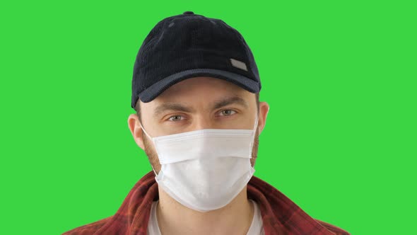 Caucasian Man Wearing a Protection Mask Making Ok Sign on a Green Screen, Chroma Key