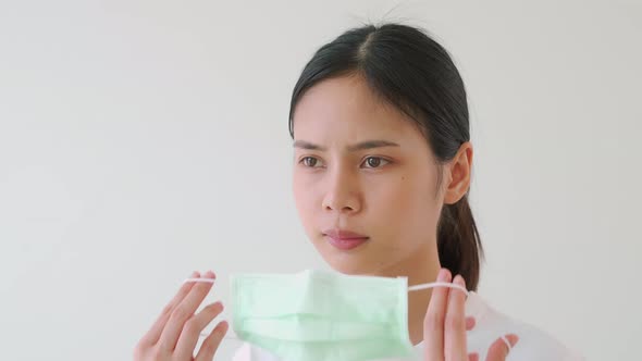 Asian women wear masks to protect disease on white background