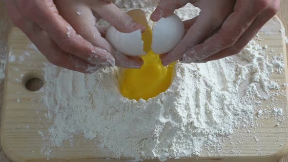 Child and Grandmother Adding Egg to Flour, Family Cooking, Home Traditions