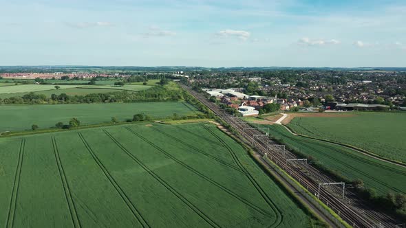 Railway in the countryside and trains passing, aerial view