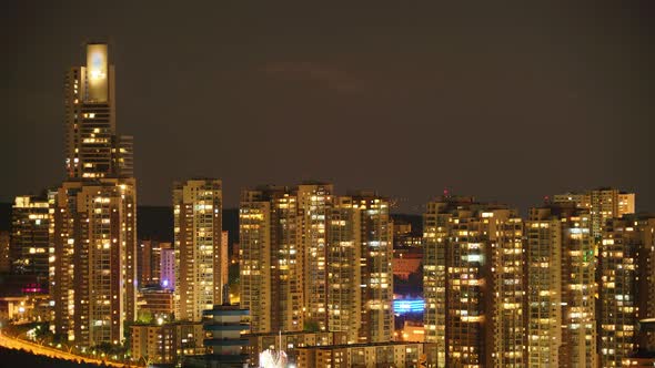 8K Modern Houses Lights In The Skyscrapers Of Crowded City