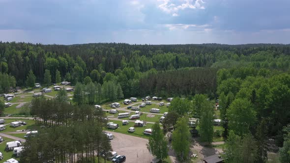 Beautiful Aerial Shot of a Caravan Park Surrounded By a Forest