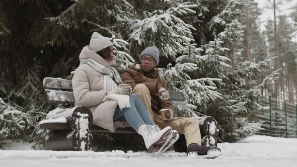 Young People Having Date on Skating Rink in Park