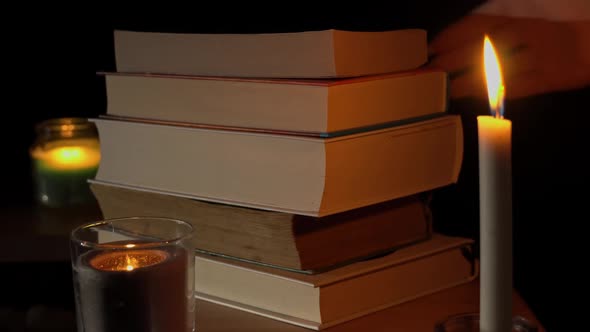 Stack of Books By Candlelight a Selection of Literature for Reading at Night