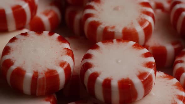 Rotating shot of peppermint candies - CANDY PEPPERMINT 064