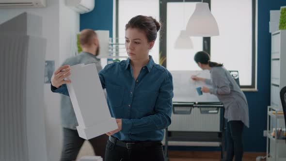 Portrait of Woman Architect Analyzing Building Model to Create Urban Project Structure