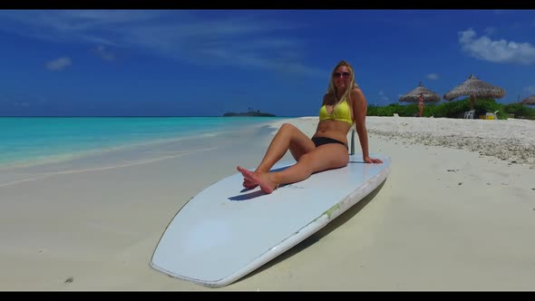 Tourists best friends on paradise coast beach trip by blue sea and white sand background of the Mald