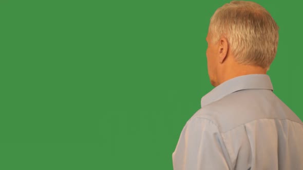 Senior Man Swiping By Finger Virtual Screen on Transparent Green Background. Mature Man Sliding on