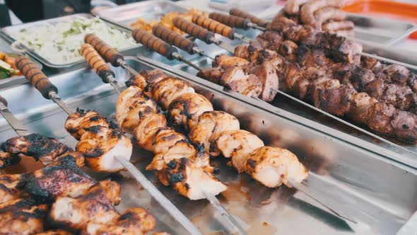 Grilled Vegetables and Meat in Street Shop Window. Food Court with Grilled Meals