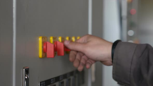 Person Adjusts the Sensors on the Device. Worker Turns the Levers of the Sensors. Professional