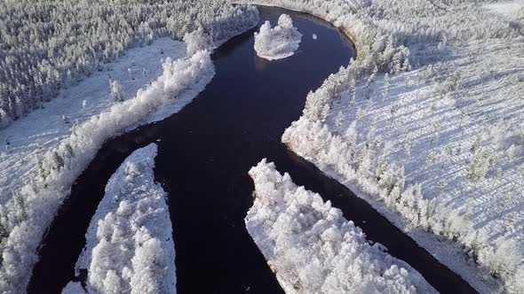 Flying above river in Lapland when first snow has just fallen to ground. Lapland Finland.