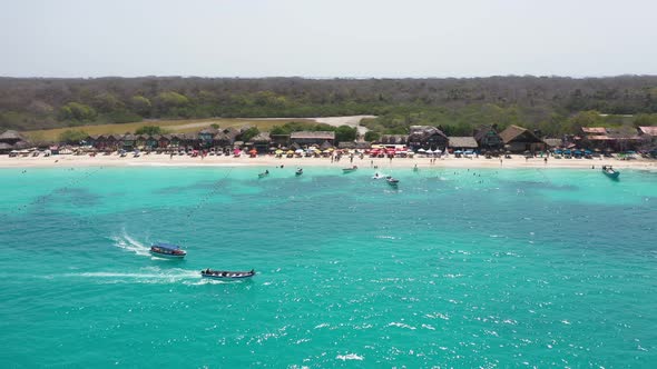 A Pleasure Boat Takes Tourists on an Excursion Along a Tropical Beach Aerial Panorama View