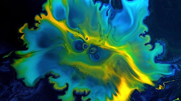 Fluid Art Drawing Video Background Motion with Yellow Blue and Green Overflowing Colors