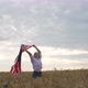 Happy Patriotic Young Woman Waves the US Flag Into the Field - VideoHive Item for Sale