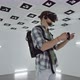 Young Man in Virtual Reality Headset Is Spending Time in Augmented Reality in an Empty Playroom Full - VideoHive Item for Sale
