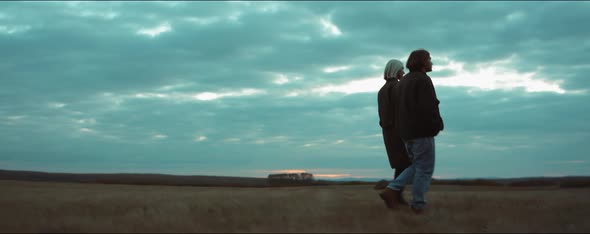 Couple Walking on Autumn Field