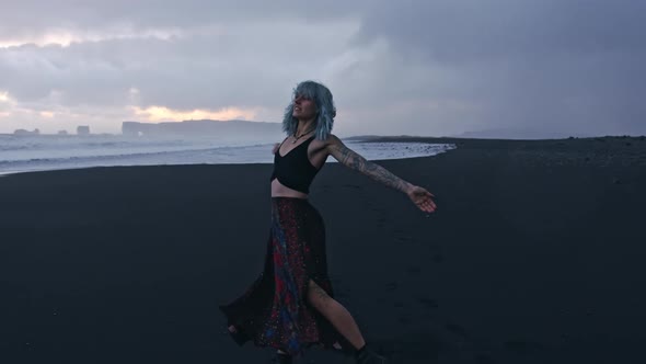 Dancing Carefree Cool Girl On Black Beach