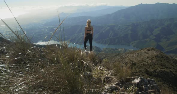 Young Blond Woman Looking At Dramatic Landscape Of La Concha