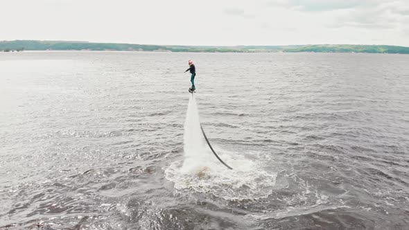 Water Sports  a Man Flying Over the Water  Aerial View