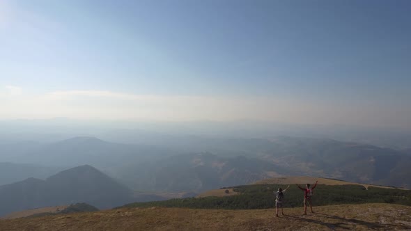 Drone view of two friends hiking in the Apennines, Umbria, Italy