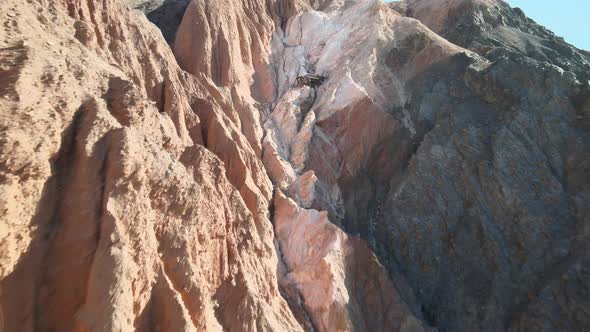 An abandoned magnesium mine sits in ruin along the colorful formations of Afton Canyon, California.